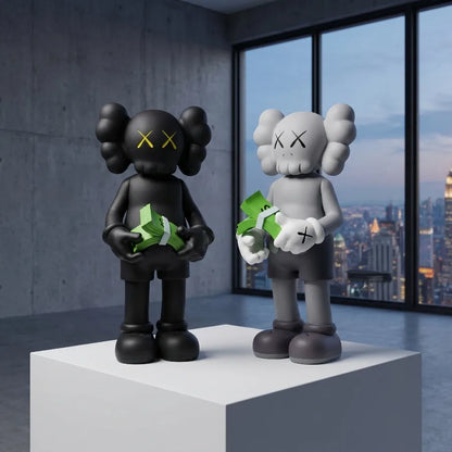 Two bear figurines on a windowsill with a city night skyline in the background