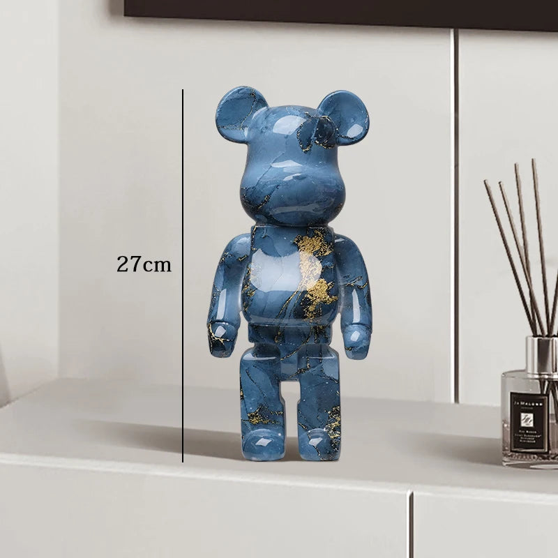 Blue blocky bear sculpture displayed on a console table