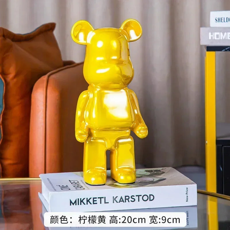 Blue bear sculpture displayed on a table in a living room setting