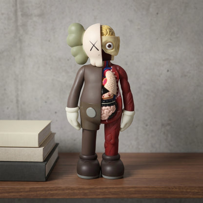 Copper-tone bear figurine seated on a concrete block against a brick wall