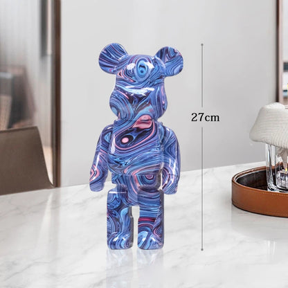 Blue blocky bear sculpture standing alone on a white background