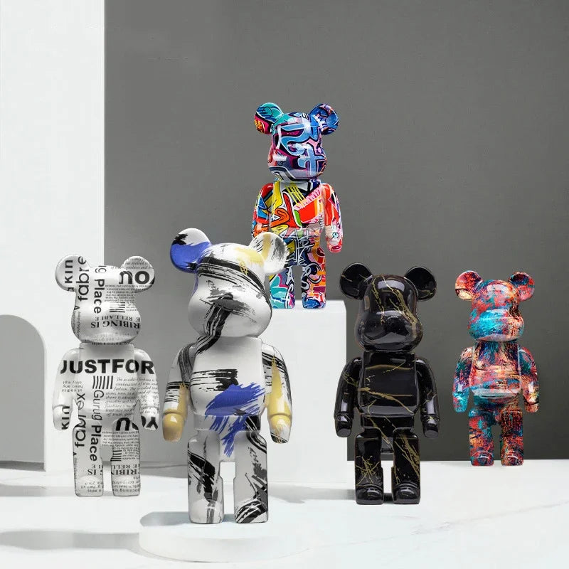 Silver chrome blocky bear sculpture displayed on a shelf