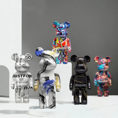 Silver chrome blocky bear sculpture displayed on a shelf